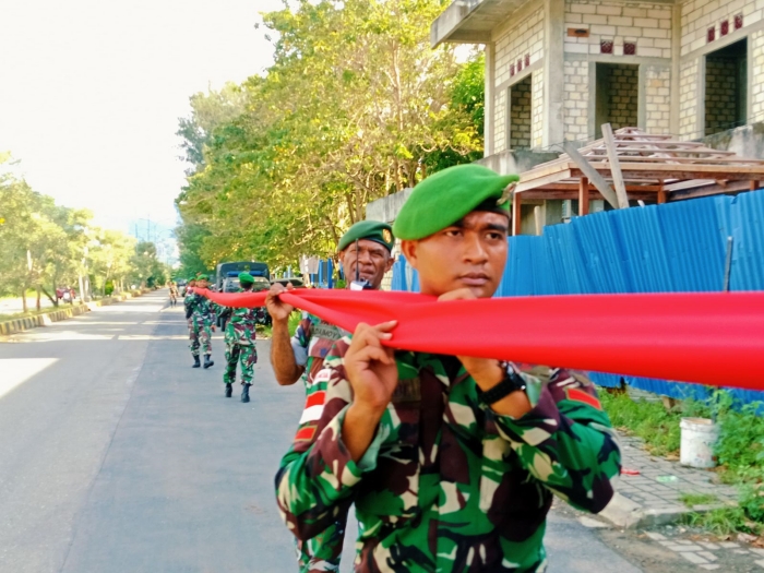 Pencapaian Rekor Muri Personel Satgas Yonif 122/TS Bersama Pemda Pembentangan Bendera Merah Putih Terpanjang di Peringatan 61 Tahun Integrasi Papua